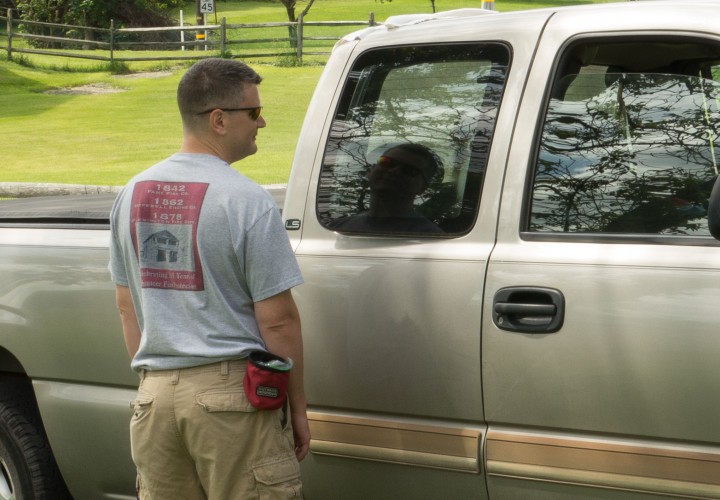 Dan smiles and watches Devlin after she gets in the truck.