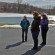 Three people brave the cold March morning to help their dogs.