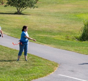 Jane, Ali and Sharon tossing treats to Chopper as he walks by, so he sees that good things come from people. But he has to check in with Donna for rewards before moving on to the next person